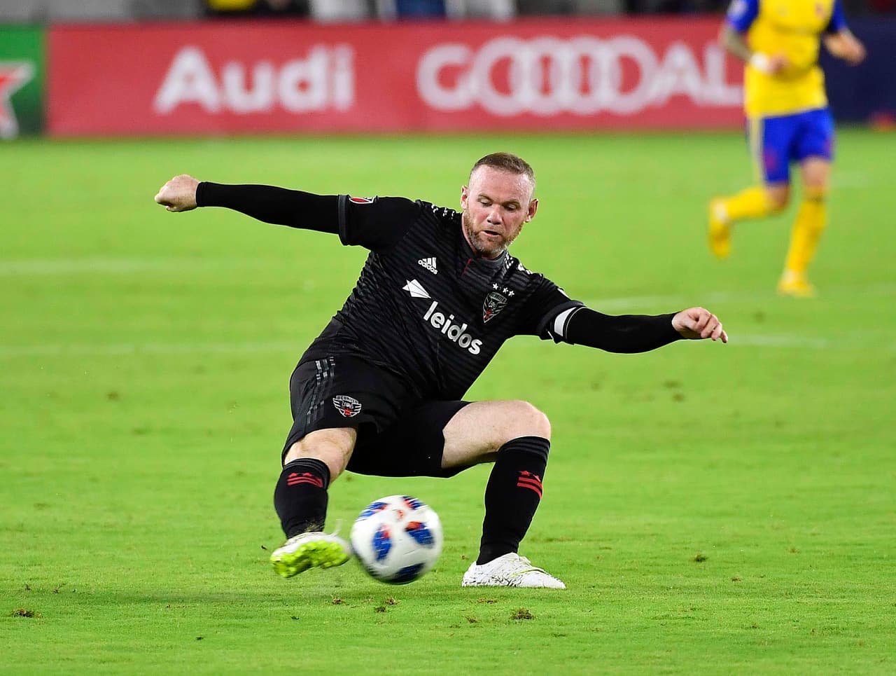 Jul 28, 2018; Washington, DC, USA; D.C. United forward Wayne Rooney (9) passes the ball against the Colorado Rapid during the second half at Audi Field. Mandatory Credit: Brad Mills-USA TODAY Sports