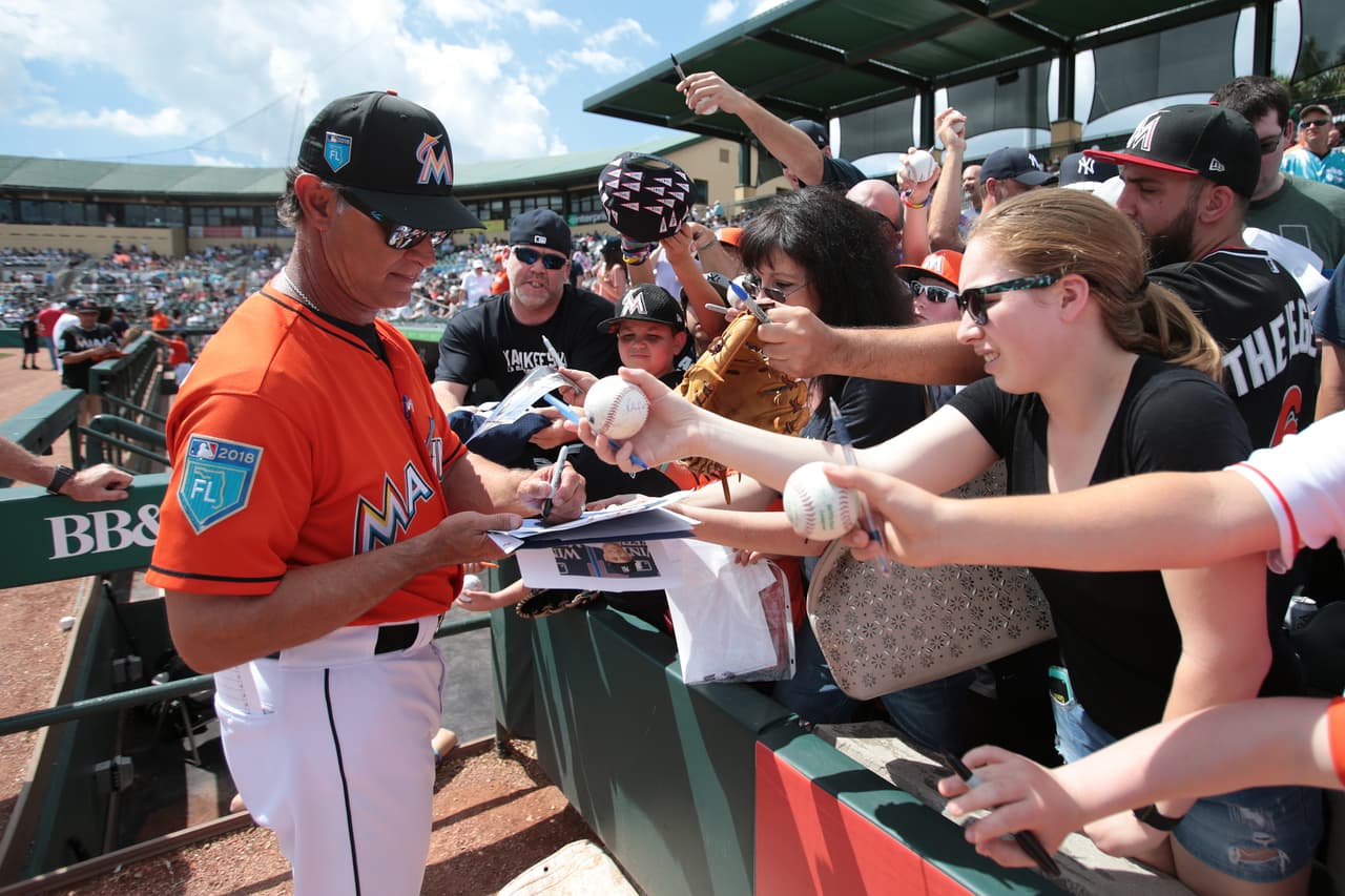 JUPITER, FL - MARCH 11: Manager Don Mattingly #8 of the Miami Marlins signs autographs for fans prior to the spring training game against the New York Yankees at Roger Dean Chevrolet Stadium on March 11, 2018 in Jupiter, Florida. The Marlins defeated the Yankees 7-5. (Photo by Joel Auerbach/Getty Images)