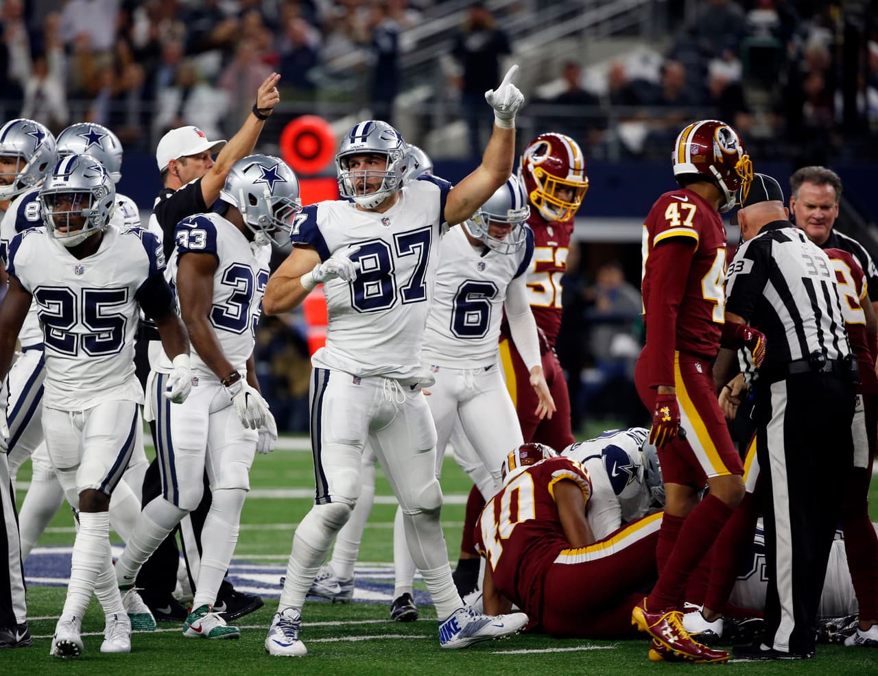 Dallas Cowboys tight end Geoff Swaim (87) and others celebrate a Washington Redskins turnover on a punt return in the first half of an NFL football game, Thursday, Nov. 30, 2017, in Arlington, Texas. (AP Photo/Ron Jenkins)