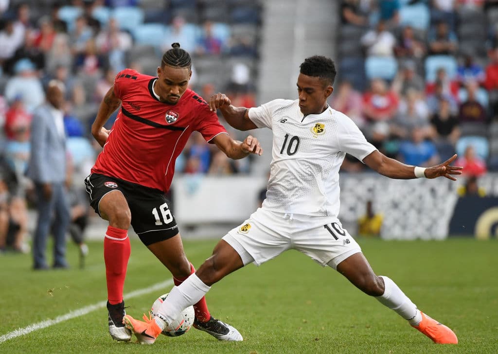 ST PAUL, MINNESOTA - JUNE 18: Alvin Jones #16 of Trinidad and Tobago competes for the ball with Edgar Barcenas #10 of Panama during the first half of the CONCACAF Gold Cup match at Allianz Field on June 18, 2019 in St Paul, Minnesota. (Photo by Hannah Foslien/Getty Images)