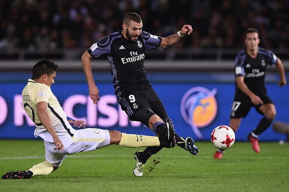 YOKOHAMA, JAPAN - DECEMBER 15: Karim Benzema of Real Madrid kicks a goal during the FIFA Club World Cup Japan semi-final match between Club America v Real Madrid at International Stadium Yokohama on December 15, 2016 in Yokohama, Japan. (Photo by Matt Roberts/Getty Images,)