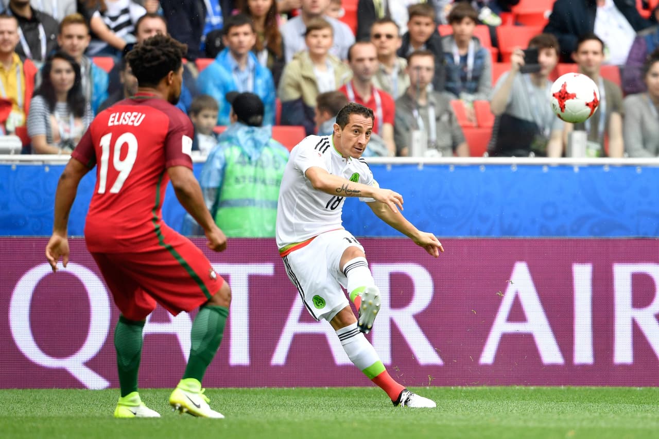 Mexico's midfielder Andres Guardado (R) kicks the ball past Portugal's defender Eliseu during the 2017 FIFA Confederations Cup third place football match between Portugal and Mexico at the Spartak Stadium in Moscow on July 2, 2017. / AFP PHOTO / Alexander NEMENOV (Photo credit should read ALEXANDER NEMENOV/AFP/Getty Images)
