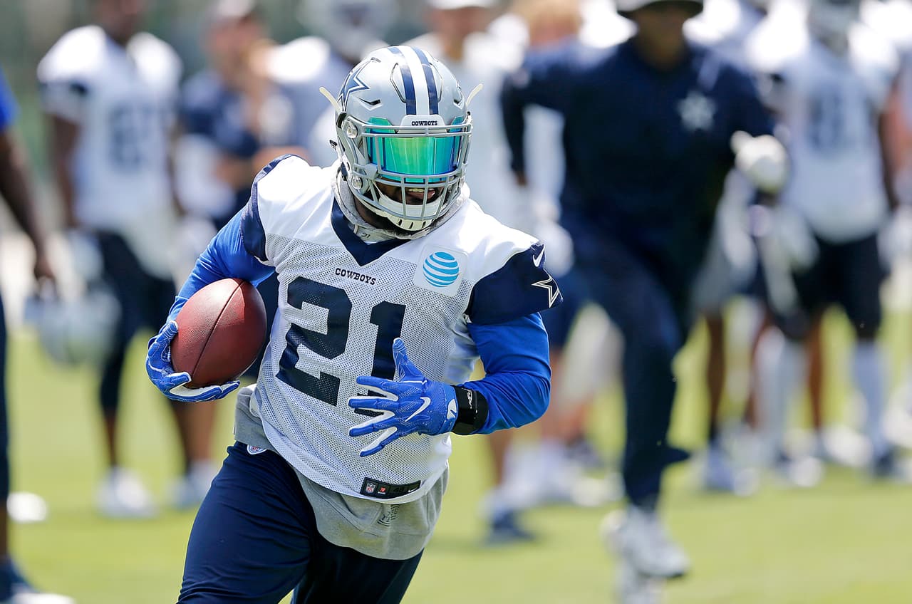 Dallas Cowboys running back Ezekiel Elliott (21) runs after a catch during an organized team activity at its NFL football training facility in Frisco, Texas, Tuesday, June 6, 2017. (James D. Smith via AP)