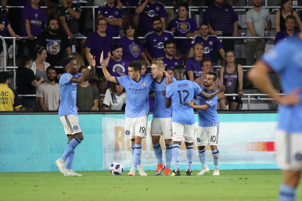 Jul 26, 2018; Orlando, FL, USA; New York City FC defender Anton Tinnerholm (3) celebrates with teammates as he scores a goal against the Orlando City SC during the first half at Orlando City Stadium. Mandatory Credit: Kim Klement-USA TODAY Sports