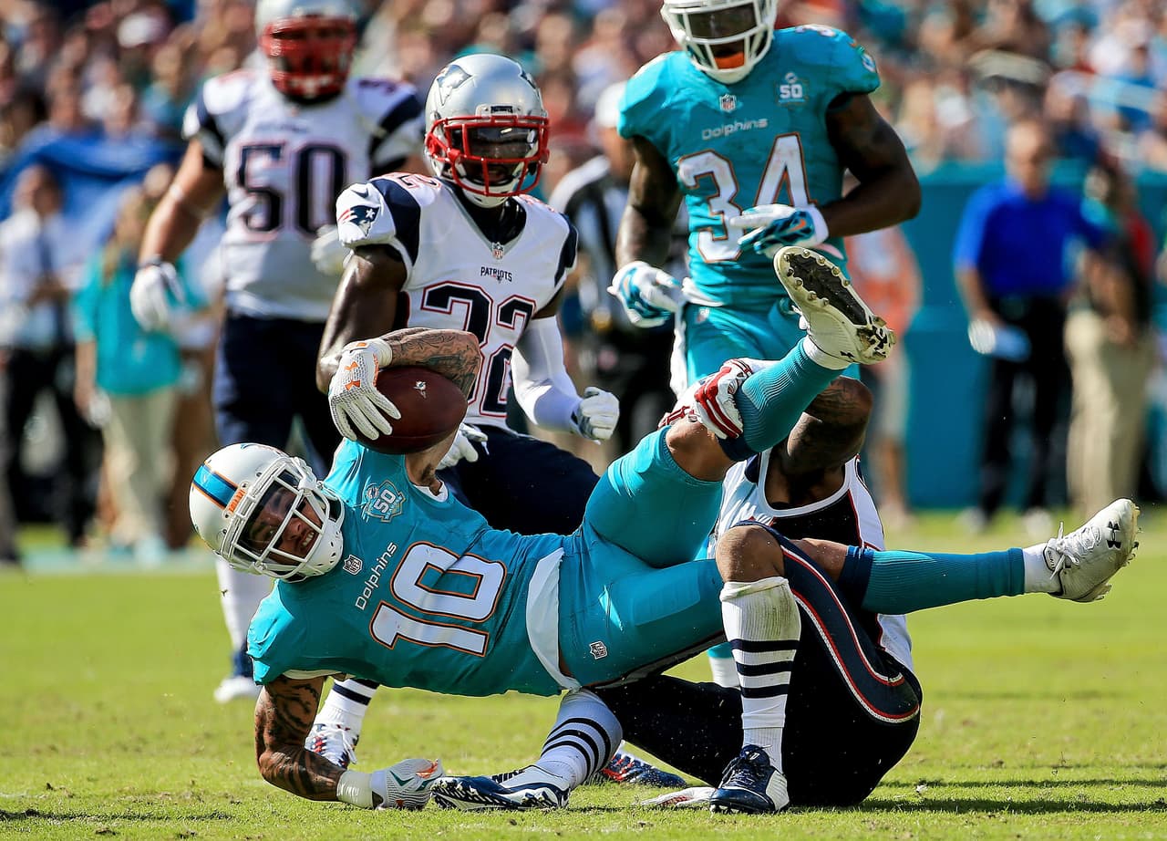 Tom Brady tuvo un mal día en Florida y los Patriots fueron derrotados 20-10 por Dolphins, y con ello la posibilidad de ser los sembrados N°1 AFC. Checa las mejores tomas de este duelo.