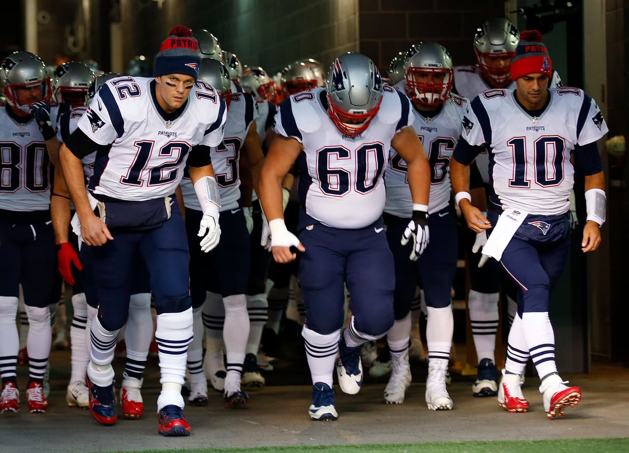 New England Patriots quarterback Tom Brady, left, and teammates take the field before an NFL football game against the New York Jets at MetLife Stadium in East Rutherford, N.J. Sunday, Nov. 17, 2016. (Winslow Townson/AP Images for Panini)
