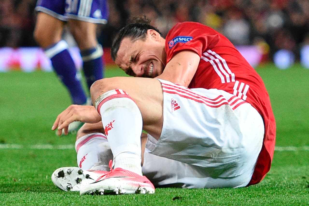 TOPSHOT - Manchester United's Swedish striker Zlatan Ibrahimovic reacts after falling awkwardly during the UEFA Europa League quarter-final second leg football match between Manchester United and Anderlecht at Old Trafford in Manchester, north west England, on April 20, 2017. / AFP PHOTO / Oli SCARFF (Photo credit should read OLI SCARFF/AFP/Getty Images)