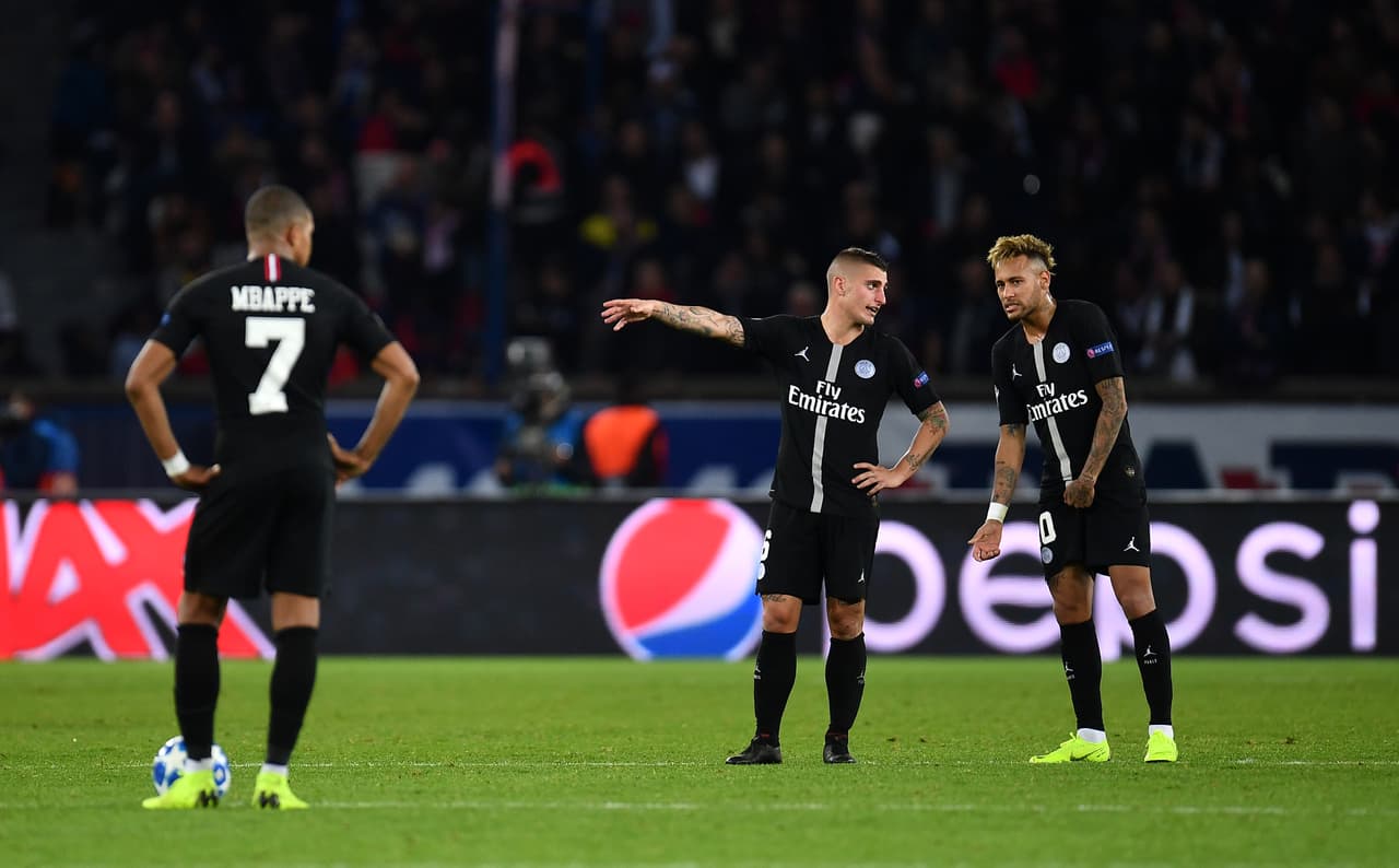PARIS, FRANCE - OCTOBER 24: Marco Verratti, Neymar of Paris Saint-Germain and Kylian Mbappe of Paris Saint-Germain looks dejected after Napoli's second goal during the Group C match of the UEFA Champions League between Paris Saint-Germain and SSC Napoli at Parc des Princes on October 24, 2018 in Paris, France. (Photo by Justin Setterfield/Getty Images)