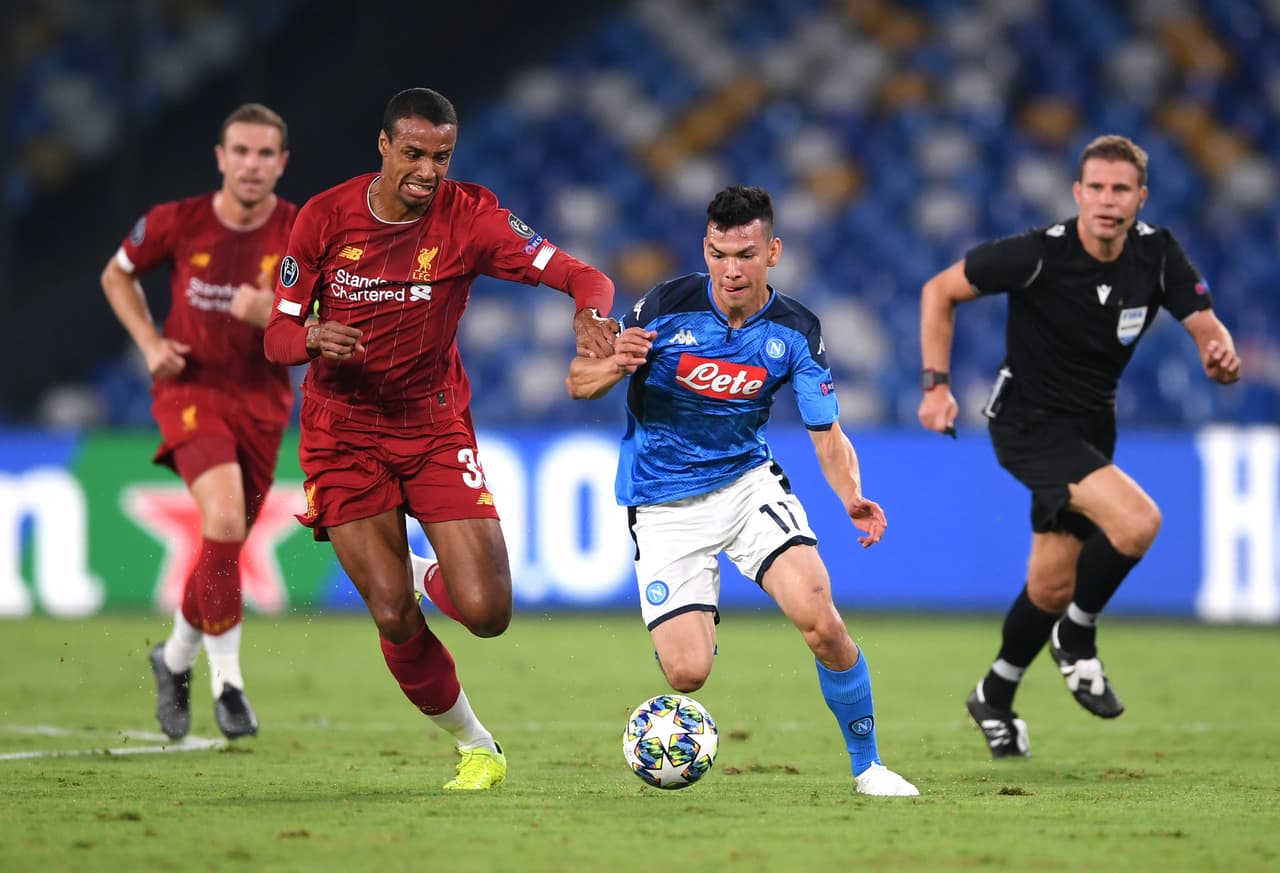 NAPLES, ITALY - SEPTEMBER 17: Hirving Lozano of Napoli takes on Joel Matip of Liverpool during the UEFA Champions League group E match between SSC Napoli and Liverpool FC at Stadio San Paolo on September 17, 2019 in Naples, Italy. (Photo by Laurence Griffiths/Getty Images)