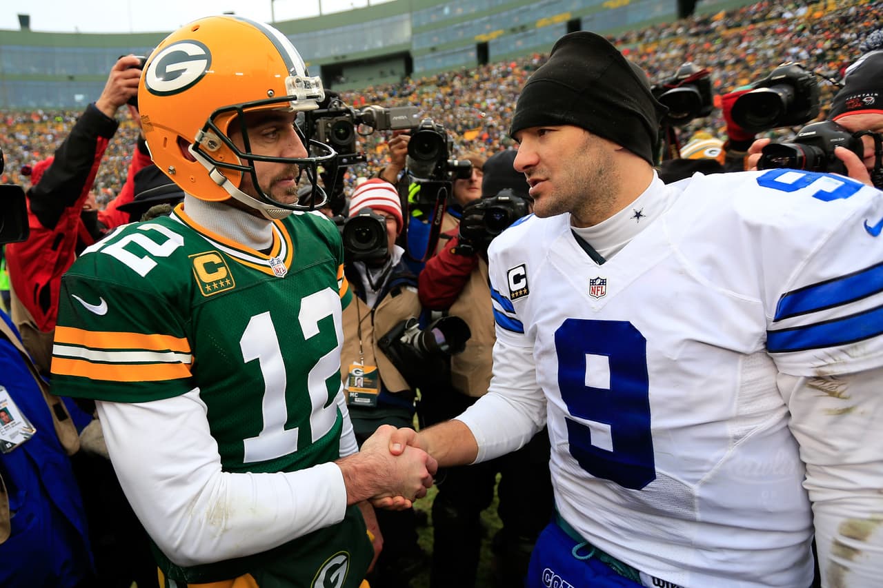 GREEN BAY, WI - JANUARY 11: Tony Romo #9 of the Dallas Cowboys congratulates Aaron Rodgers #12 of the Green Bay Packers after the 2015 NFC Divisional Playoff game at Lambeau Field on January 11, 2015 in Green Bay, Wisconsin. The Packers defeated the Cowboys 26-21. (Photo by Rob Carr/Getty Images)