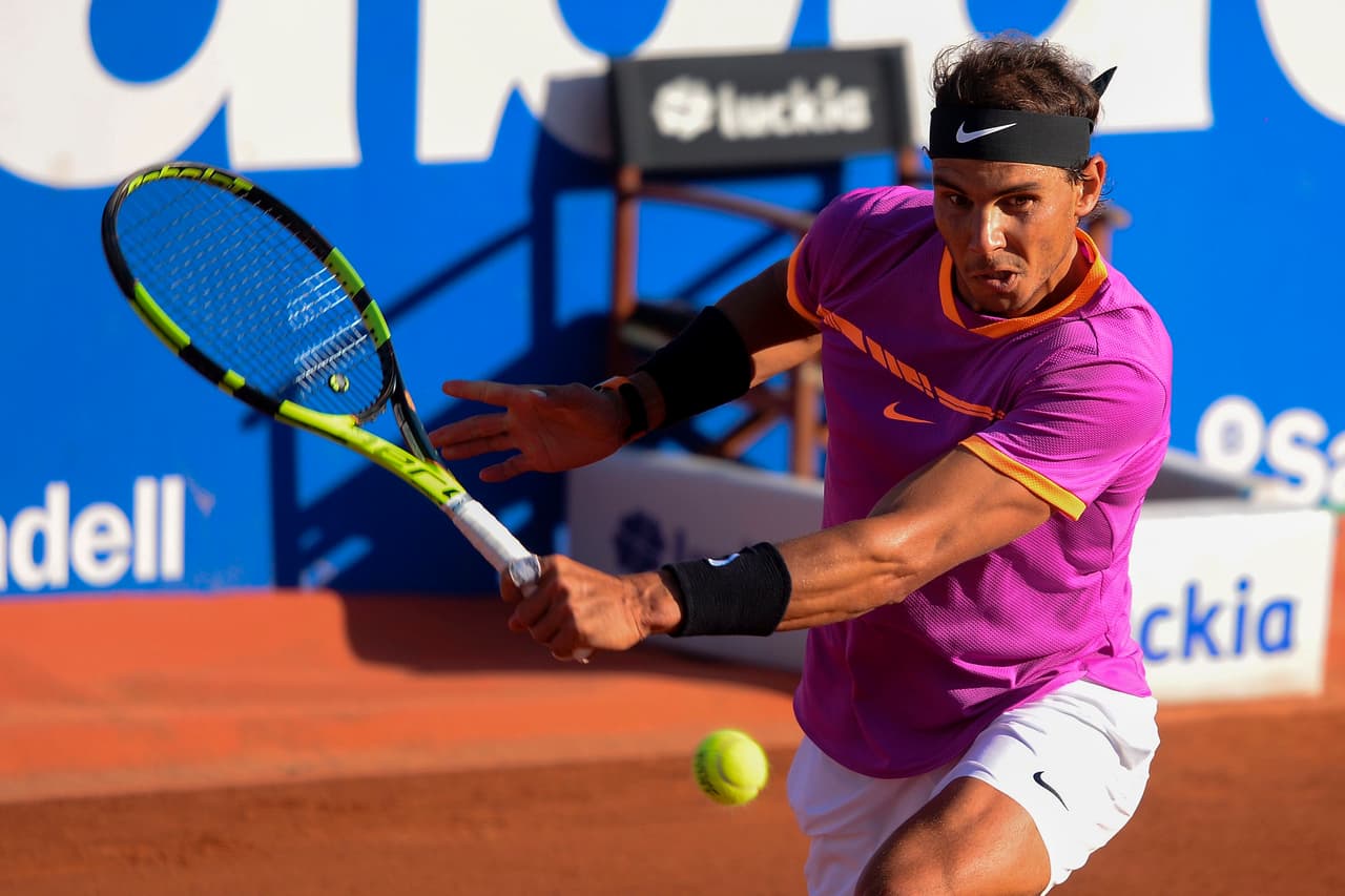 Spanish tennis player Rafael Nadal returns the ball to South Korean tennis player Hyeon Chung during the ATP Barcelona Open "Conde de Godo" tennis tournament in Barcelona on April 28, 2017. / AFP PHOTO / Josep LAGO (Photo credit should read JOSEP LAGO/AFP/Getty Images)