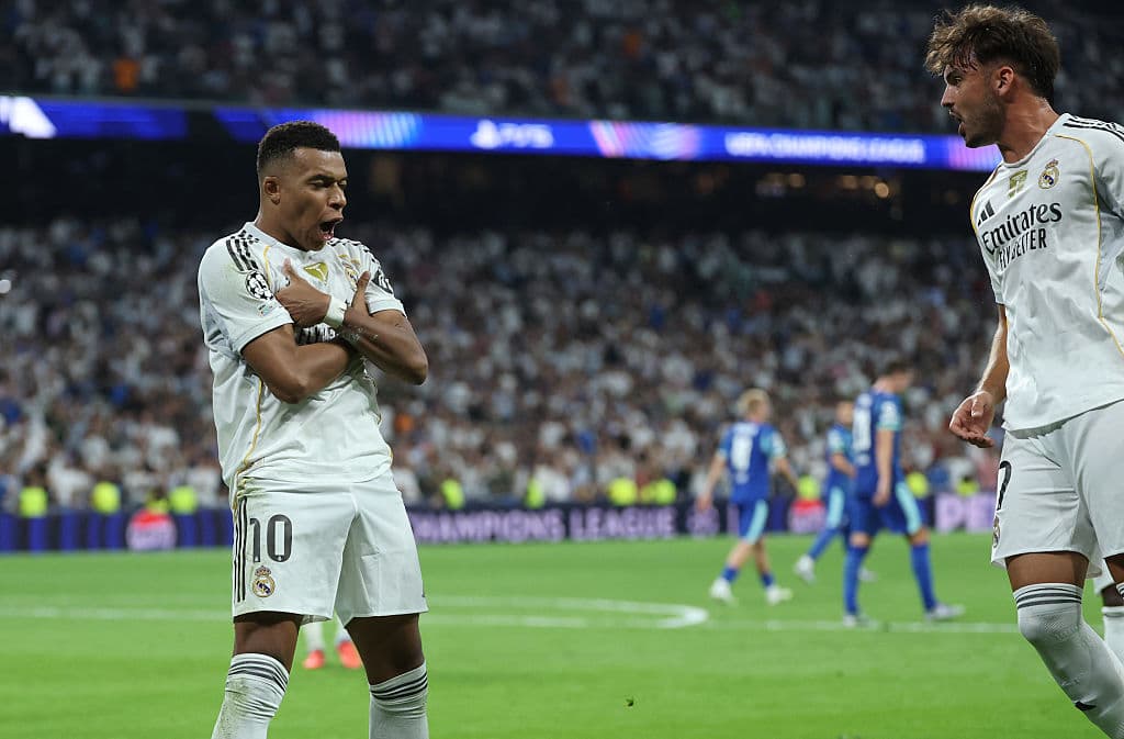 Real Madrid's French forward #10 Kylian Mbappe celebrates scoring his team's second goal from the penalty spot during the UEFA Champions League first round day 1 football match between Real Madrid CF and Olympique de Marseille at the Santiago Bernabeu stadium in Madrid on September 16, 2025. (Photo by Thomas COEX / AFP) (Photo by THOMAS COEX/AFP via Getty Images)