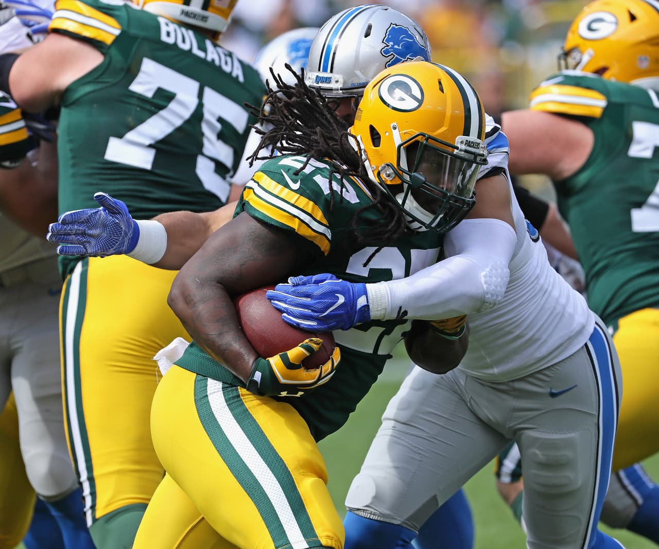 GREEN BAY, WI - SEPTEMBER 25: Eddie Lacy #27 of the Green Bay Packers is hit by Kyle Van Noy #53 of the Detroit Lions at Lambeau Field on September 25, 2016 in Green Bay, Wisconsin. The Packers defeated the Lions 34-27. (Photo by Jonathan Daniel/Getty Images)
