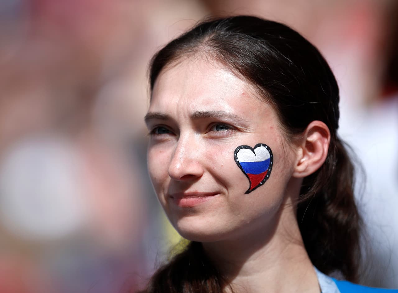 A Russian fan smiles ahead of the group A match between Russia and Saudi Arabia which opens the 2018 soccer World Cup at the Luzhniki stadium in Moscow, Russia, Thursday, June 14, 2018. (AP Photo/Hassan Ammar)