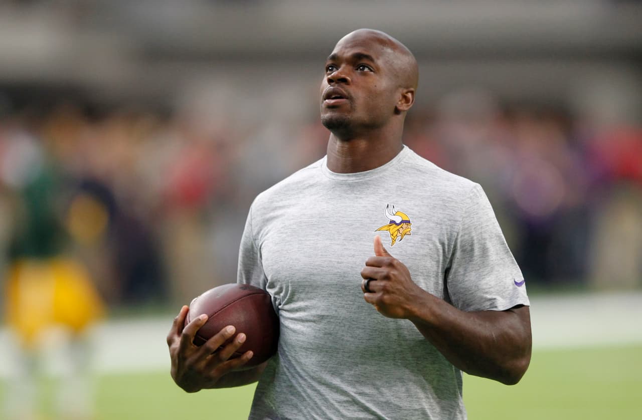 FILE - In this Sept. 18, 2016, file photo, Minnesota Vikings running back Adrian Peterson warms up before an NFL football game against the Green Bay Packers, in Minneapolis. Vikings running back Adrian Peterson is moving forward in the recovery from surgery on his right knee. Peterson ran some short sprints in the team's indoor facility on Tuesday, Nov. 29, 2016, while the athletic training staff supervised and his teammates went through practice. (AP Photo/Andy Clayton-King, File)