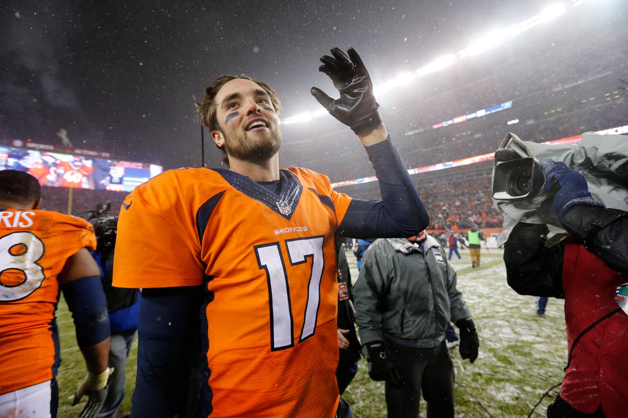 Denver Broncos quarterback Brock Osweiler (17) celebrates following the NFL regular season game against the New England Patriots on Sunday, Nov. 29, 2015 in Denver. The Broncos won in overtime, 30-24. (Ric Tapia via AP)