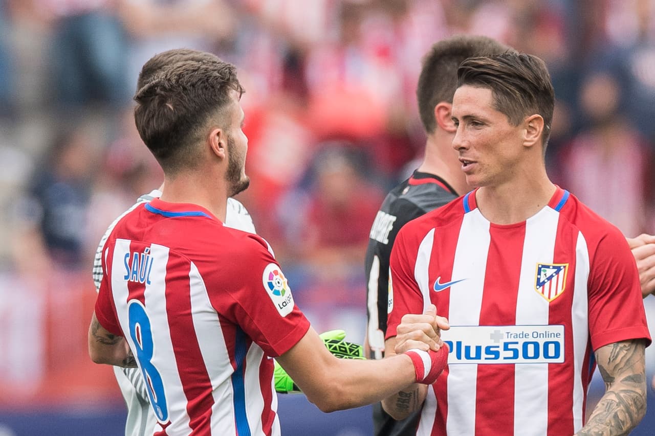 MADRID, SPAIN - MAY 21: Saul Niguez Esclapez (L) and Fernando Torres (R) of Atletico de Madrid celebrate their win after their La Liga match between Atletico de Madrid and Athletic de Bilbao at the Estadio Vicente Calderon on 21 May 2017 in Madrid, Spain. (Photo by Power Sport Images/Getty Images)