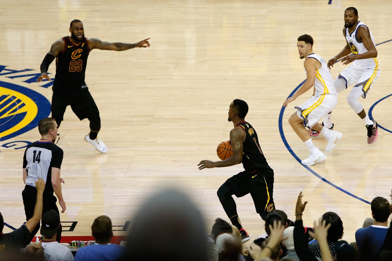 OAKLAND, CA - MAY 31: JR Smith #5 of the Cleveland Cavaliers dribbles in the closing seconds of regulation as LeBron James #23 attempts direct the offense against the Golden State Warriors in Game 1 of the 2018 NBA Finals at ORACLE Arena on May 31, 2018 in Oakland, California. NOTE TO USER: User expressly acknowledges and agrees that, by downloading and or using this photograph, User is consenting to the terms and conditions of the Getty Images License Agreement. (Photo by Lachlan Cunningham/Getty Images)