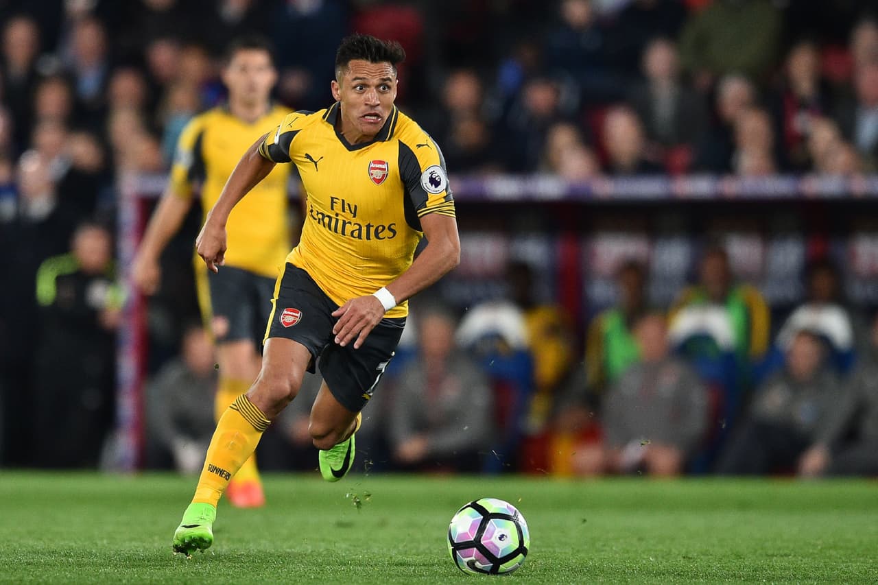Arsenal's Chilean striker Alexis Sanchez runs with the ball during the English Premier League football match between Crystal Palace and Arsenal at Selhurst Park in south London on April 10, 2017. Crystal Palace won the game 3-0. / AFP PHOTO / Glyn KIRK / RESTRICTED TO EDITORIAL USE. No use with unauthorized audio, video, data, fixture lists, club/league logos or 'live' services. Online in-match use limited to 75 images, no video emulation. No use in betting, games or single club/league/player publications. / (Photo credit should read GLYN KIRK/AFP/Getty Images)