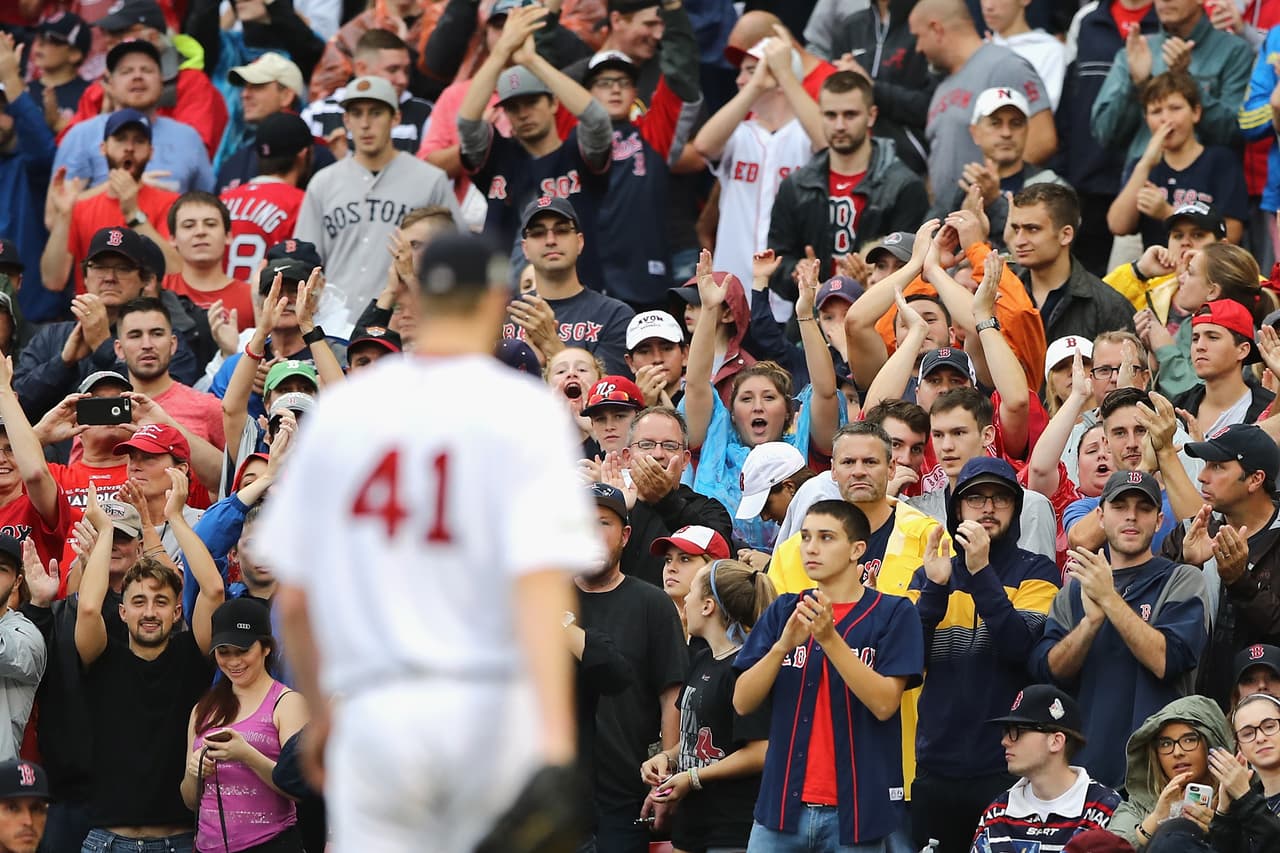 BOSTON, MA - OCTOBER 09: Fans cheer as Chris Sale #41 of the Boston Red Sox is relieved in the eighth inning against the Houston Astros during game four of the American League Division Series at Fenway Park on October 9, 2017 in Boston, Massachusetts. (Photo by Elsa/Getty Images)
