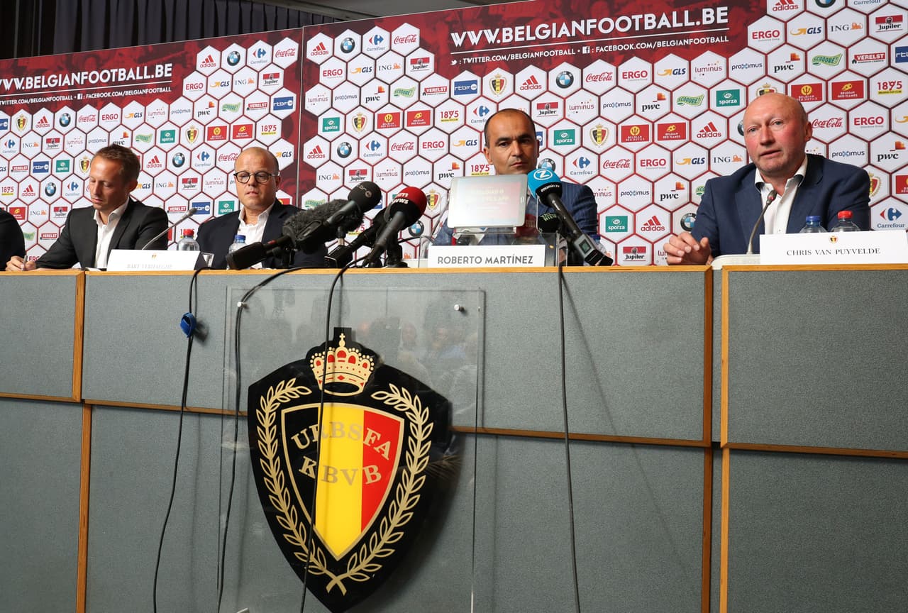 (From L) Belgium football union (KBVB-URBSFA) business director Bob Madou, KBVB-URBSFA vice-chairman Bart Verhaeghe, Belgium's national team new head coach Roberto Martinez and KBVB-URBSFA sports director Chris Van Puyvelde on August 4, 2016 give a press conference at the KBVB-URBSFA Belgian football union headquarters in Brussels. Former Everton and Wigan coach Spaniard Roberto Martinez has been given the enviable task of leading Belgium's multi-talented national side to the 2018 World Cup in Russia, The Belgian federation said on August 3, 2016. The 43-year-old Spaniard known for building flair sides with a penchant for attack, takes over from the unpopular coach Marc Wilmots, who was fired after a quarter-finals elimination by Wales at Euro 2016. / AFP / BELGA / VIRGINIE LEFOUR / Belgium OUT (Photo credit should read VIRGINIE LEFOUR/AFP/Getty Images)