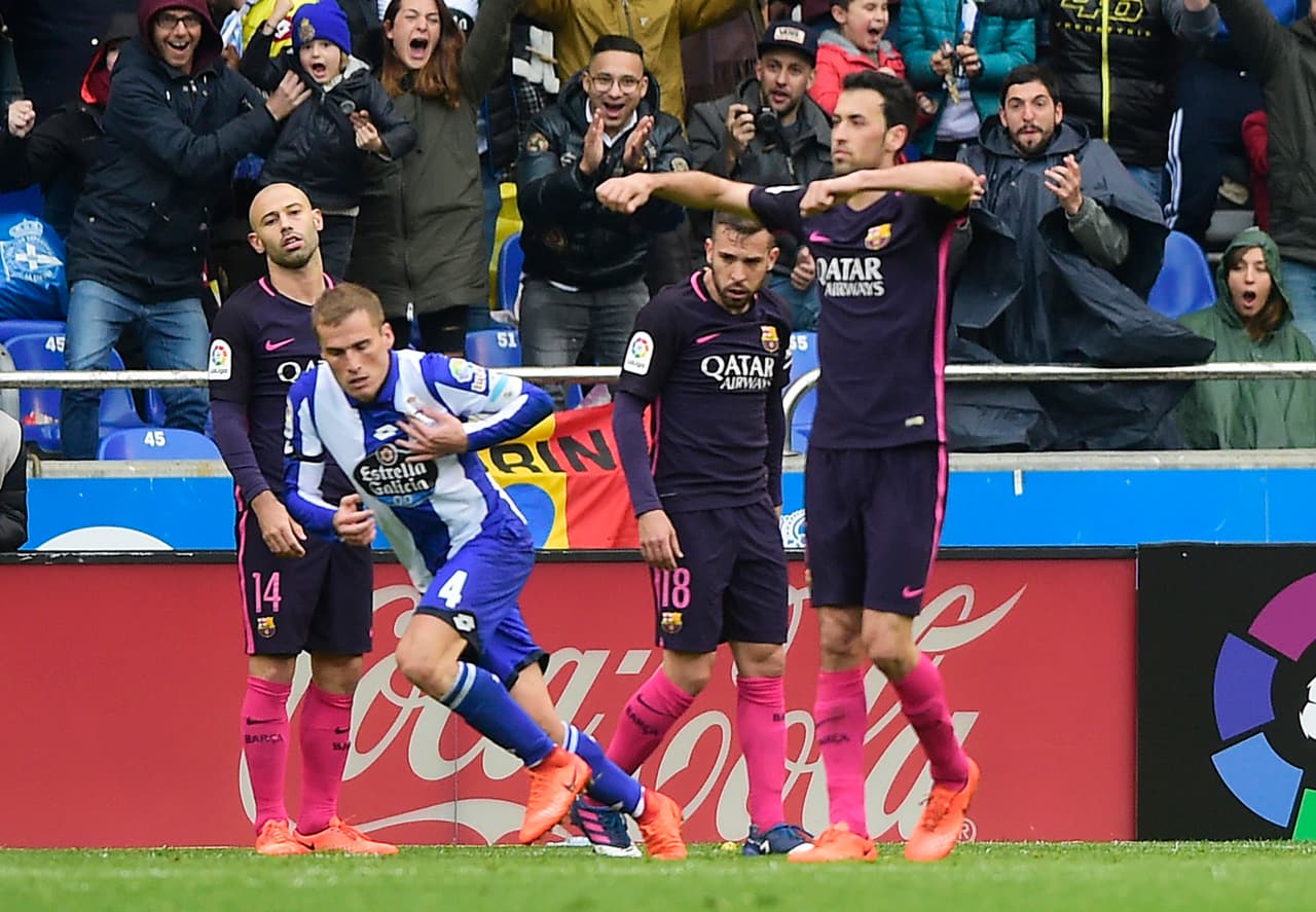 Deportivo La Coruna's midfielder Alex Bergantinos celebrates after scoring during the Spanish league football match RC Deportivo de la Coruna vs FC Barcelona at the Municipal de Riazor stadium in La Coruna on March 12, 2017. / AFP PHOTO / MIGUEL RIOPA (Photo credit should read MIGUEL RIOPA/AFP/Getty Images)