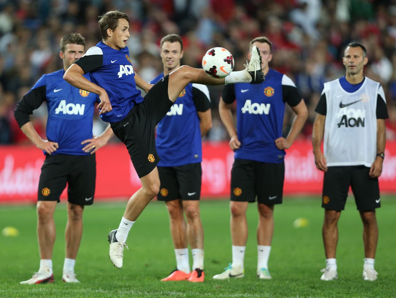 Ya en el verano del 2013, tras la marcha de Sir Álex Ferguson, fue incluido con la primera plantilla y le fue asignado un número de jugador mayor.