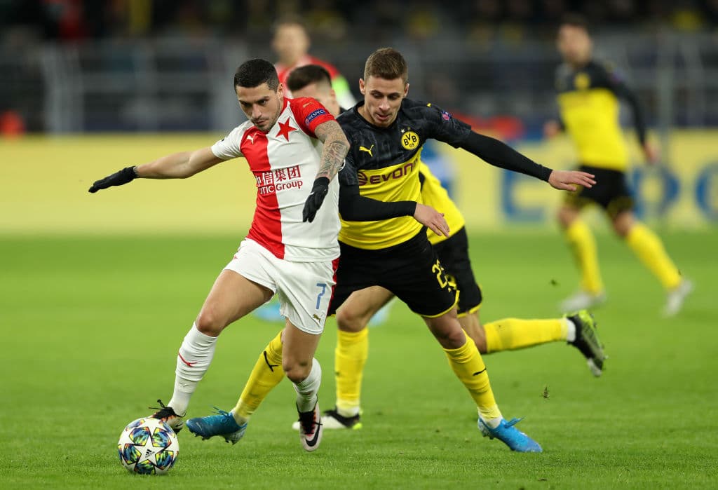 DORTMUND, GERMANY - DECEMBER 10: Nicolae Stanciu of Slavia Praha and Thorgan Hazard of Borussia Dortmund during the UEFA Champions League group F match between Borussia Dortmund and Slavia Praha at Signal Iduna Park on December 10, 2019 in Dortmund, Germany. (Photo by Lars Baron/Getty Images)