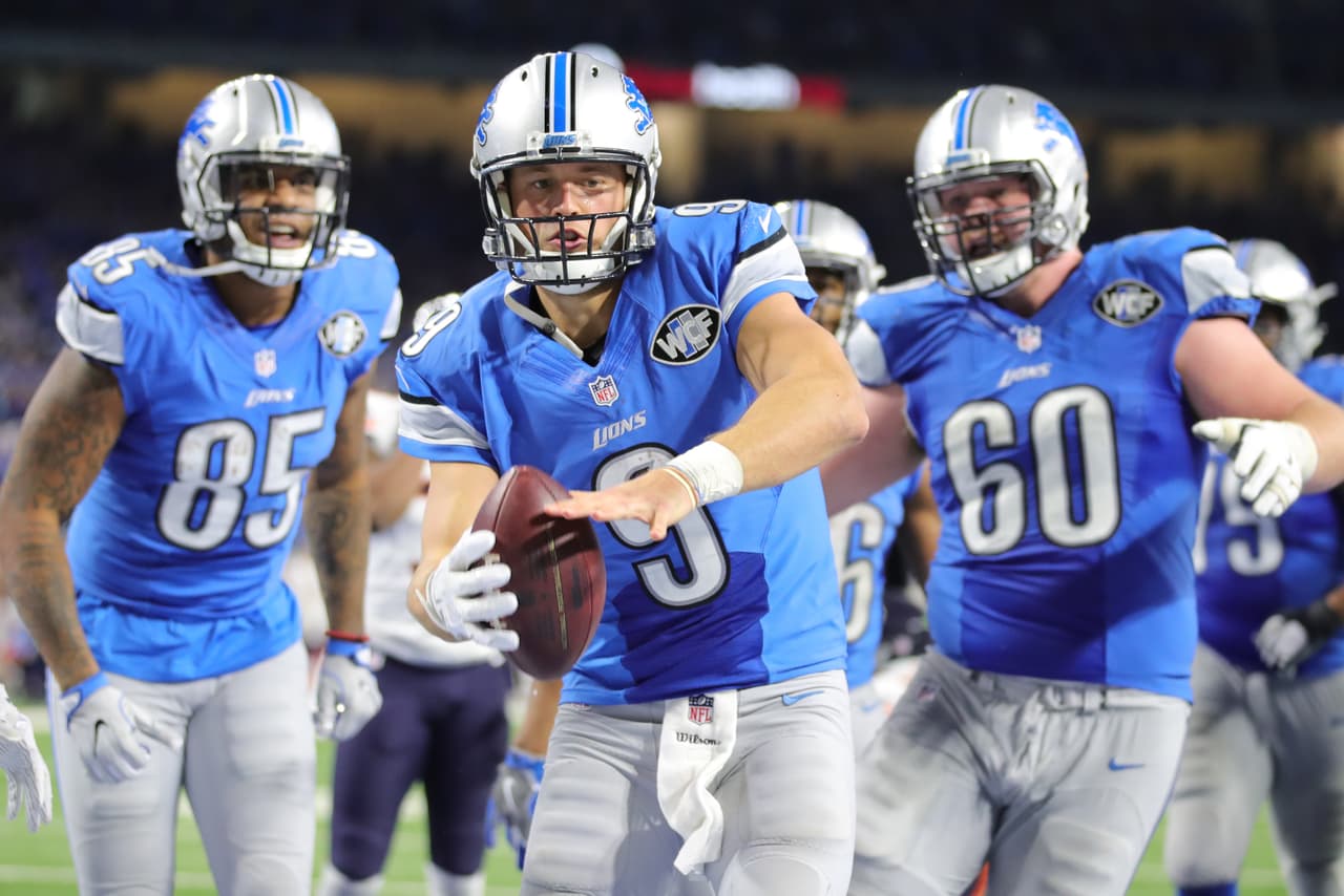 Detroit Lions quarterback Matthew Stafford (9) celebrates a game-winning touchdown run during a NFL football game against the Chicago Bears on Sunday, Dec. 11, 2016 in Detroit. (Detroit Lions via AP)