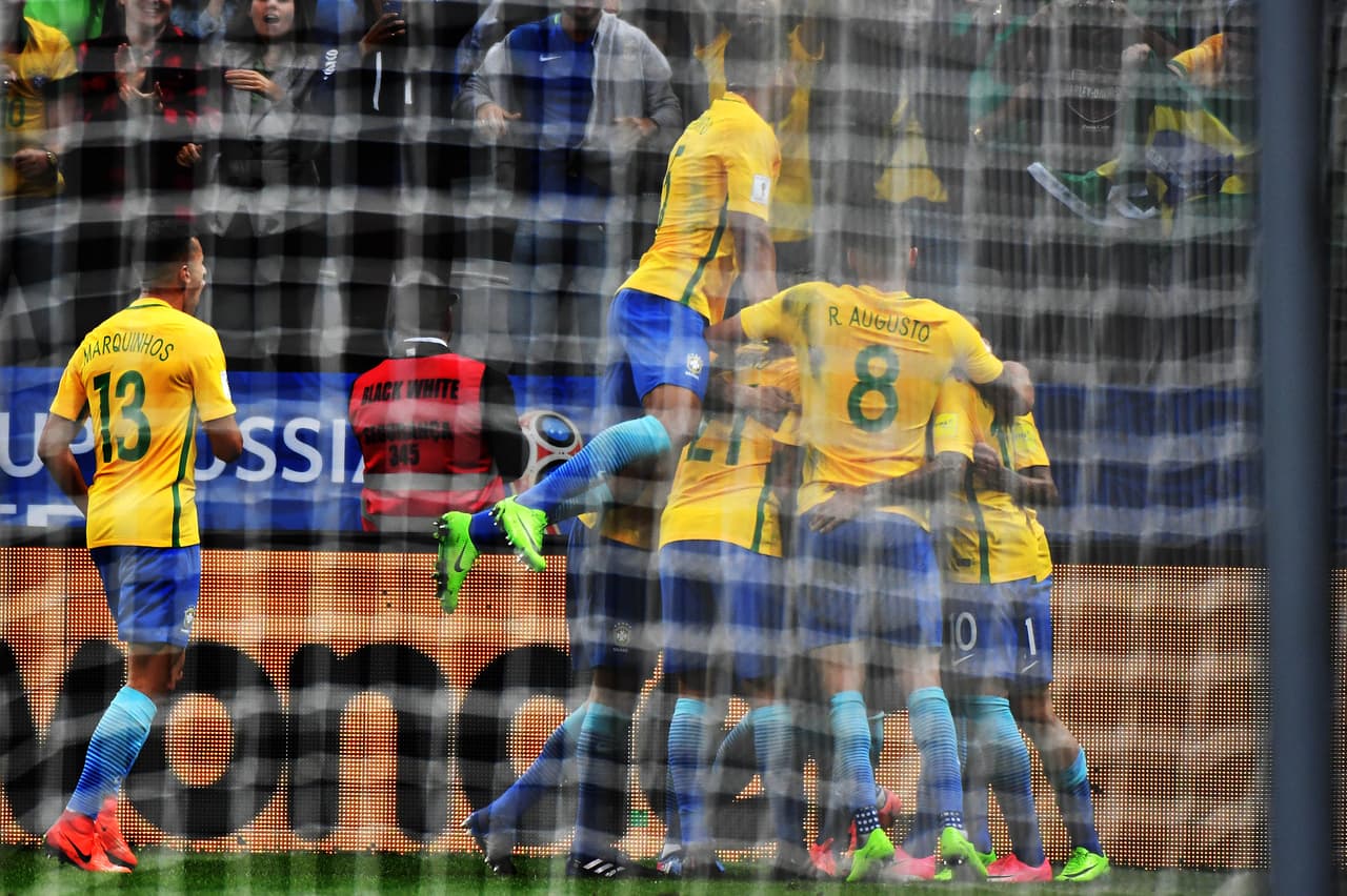 Brazil's players celebrate a goal against Paraguay during their 2018 FIFA World Cup qualifier football match in Sao Paulo, Brazil on March 28, 2017. / AFP PHOTO / NELSON ALMEIDA (Photo credit should read NELSON ALMEIDA/AFP/Getty Images)