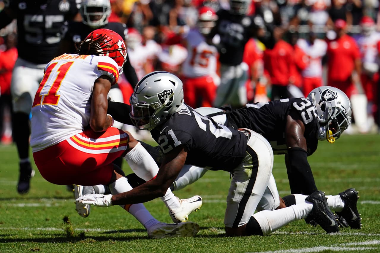 OAKLAND, CALIFORNIA - SEPTEMBER 15: Demarcus Robinson #11 of the Kansas City Chiefs is tackled by Gareon Conley #21 and Curtis Riley #35 of the Oakland Raiders during the second quarter at RingCentral Coliseum on September 15, 2019 in Oakland, California. (Photo by Daniel Shirey/Getty Images)