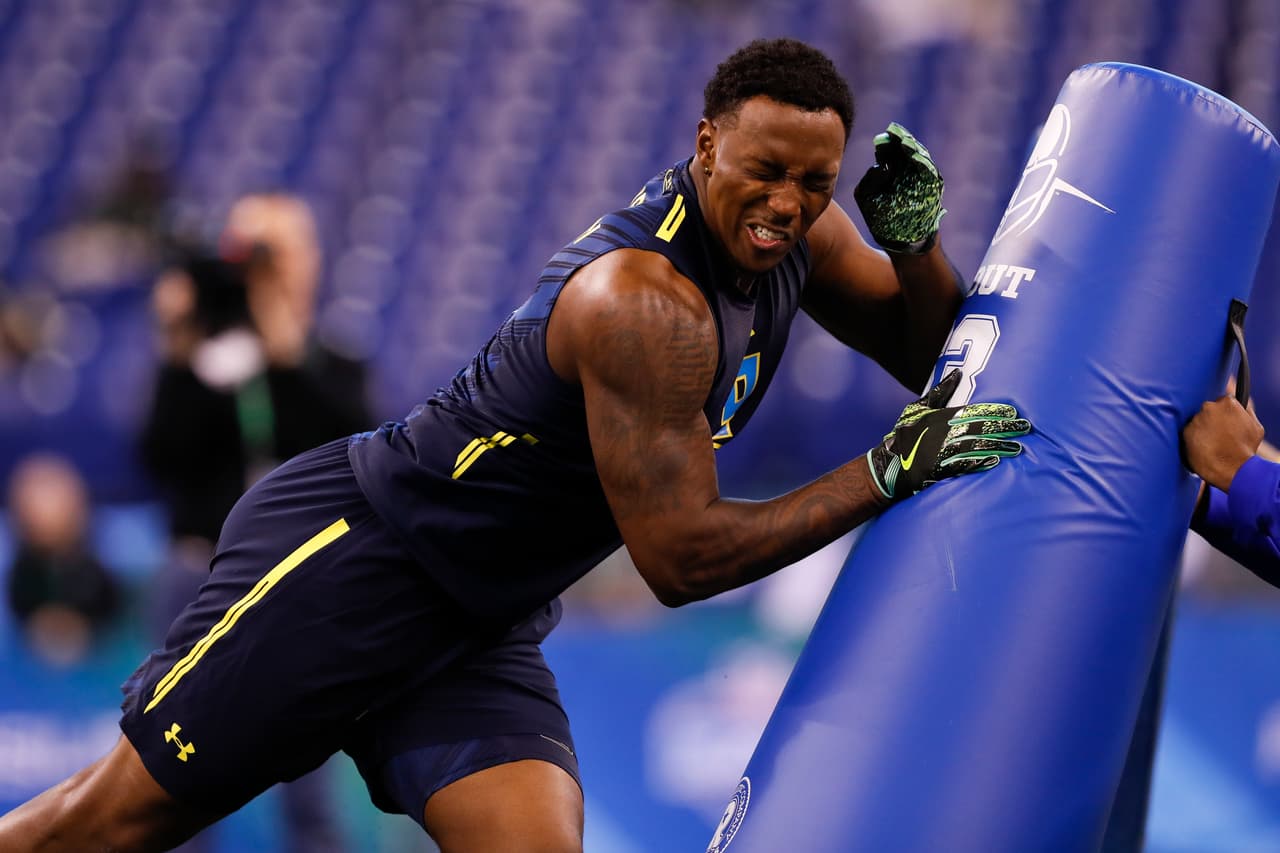 Michigan defensive end Taco Charlton runs in a drill at the NFL football scouting combine on Sunday, March 5, 2017, in Indianapolis. (Aaron M. Sprecher via AP)