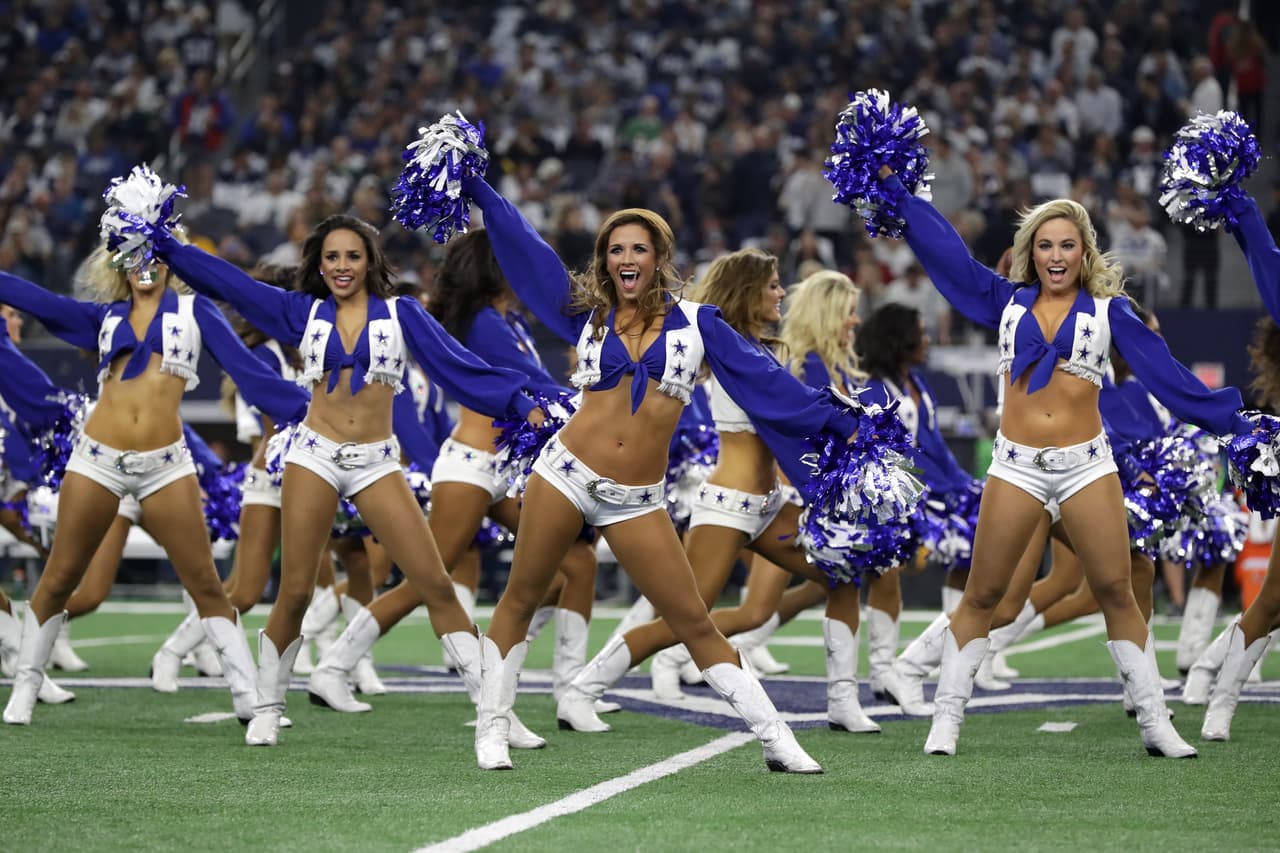 ARLINGTON, TX - JANUARY 15: The Dallas Cowboys cheerleaders perform on the field prior to the NFC Divisional Playoff game against the Green Bay Packers at AT&T Stadium on January 15, 2017 in Arlington, Texas. (Photo by Ronald Martinez/Getty Images)