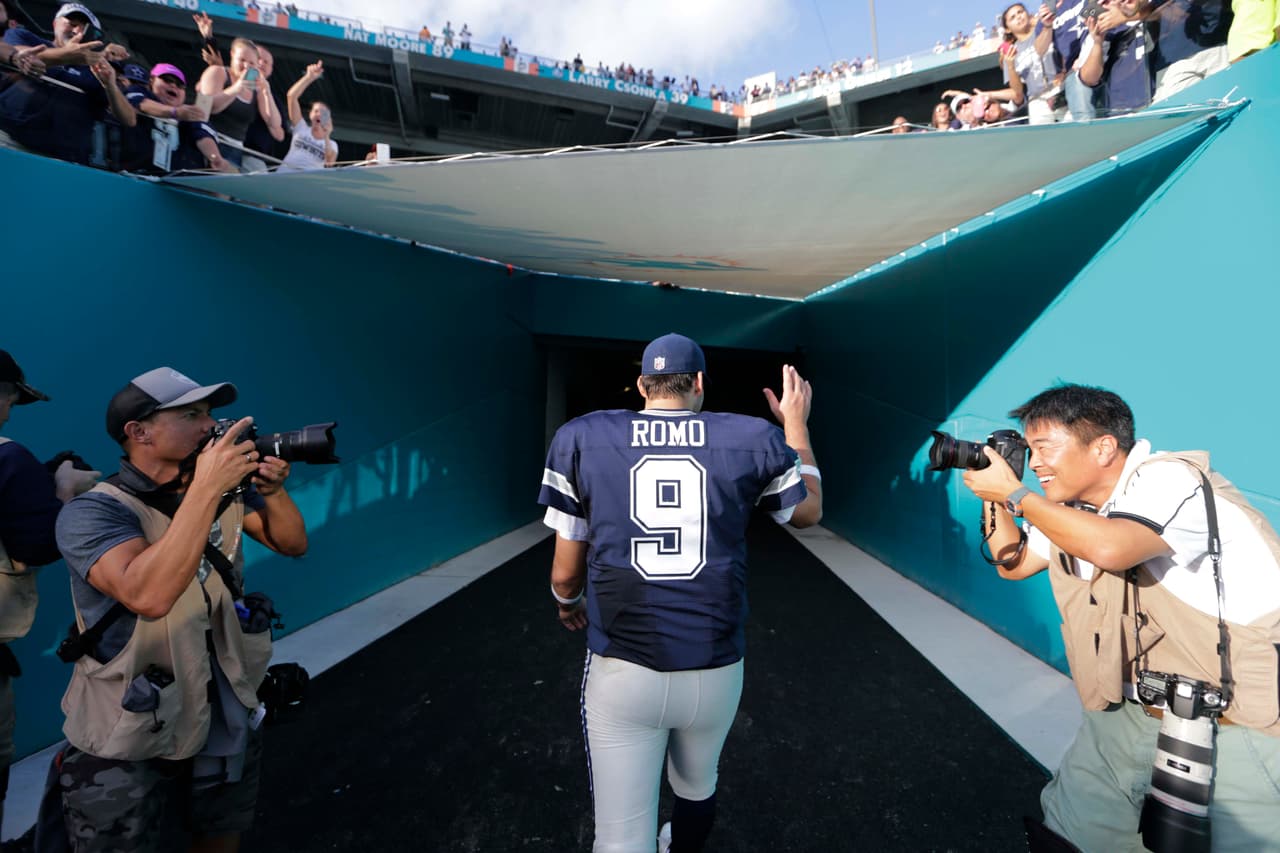Dallas Cowboys quarterback Tony Romo (9) leaves the field at the end of an NFL football game against the Miami Dolphins, Sunday, Nov. 22, 2015, in Miami Gardens, Fla. The Cowboys defeated the Dolphins 24-14. (AP Photo/Lynne Sladky)