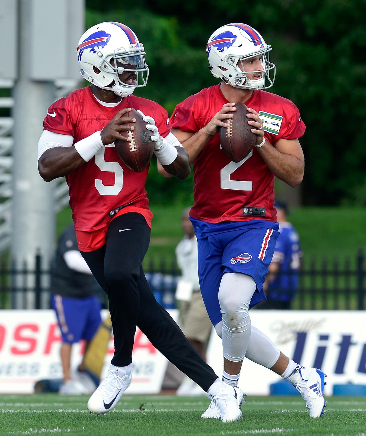 Buffalo Bills quarterbacks Tyrod Taylor, left, and Nathan Peterman (2) during NFL football team training camp in Pittsford, N.Y., Thursday, July 27, 2017. (AP Photo/Adrian Kraus)