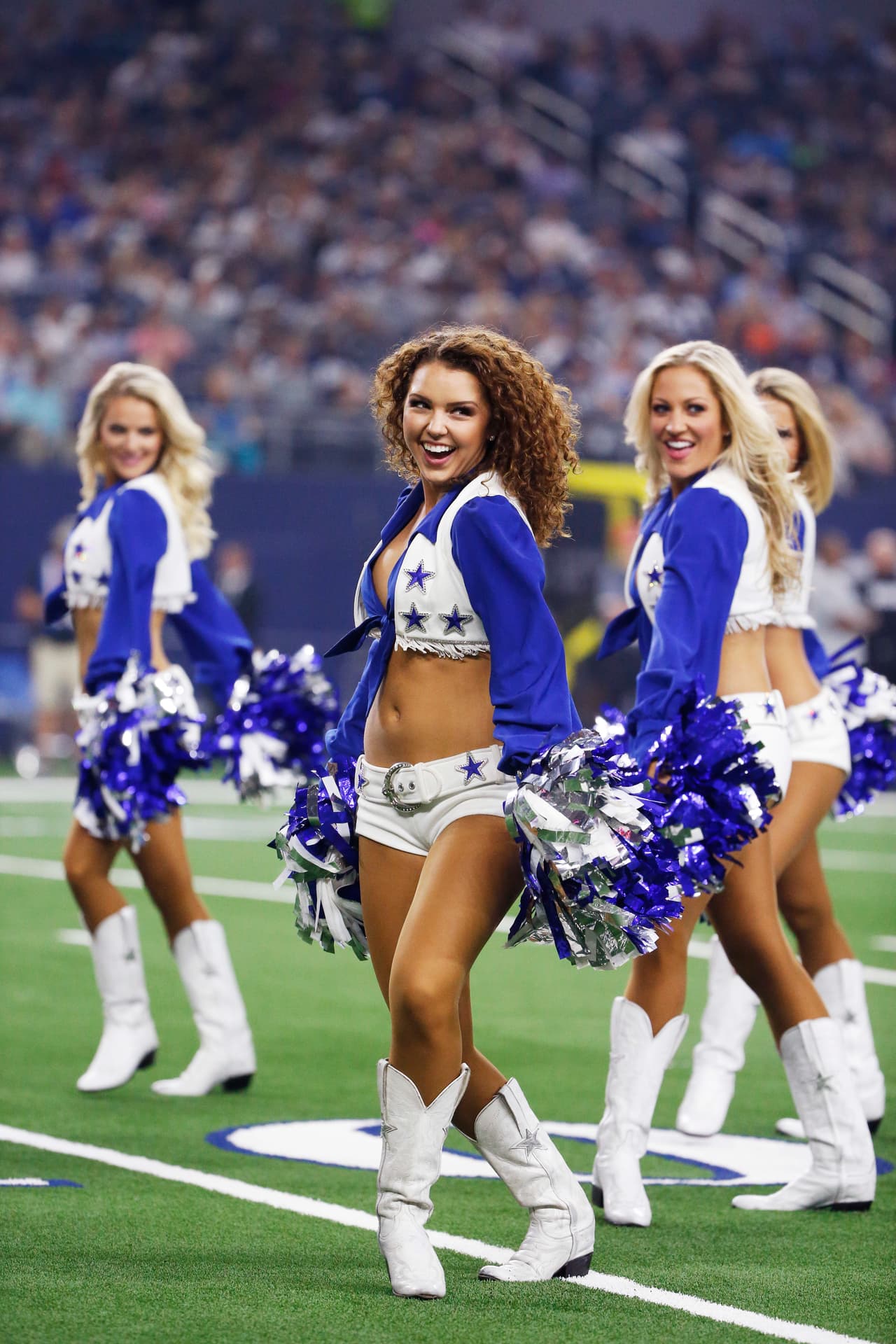 Dallas Cowboys cheerleaders perform during the first half of a preseason NFL football game against the Arizona Cardinals in Arlington, Texas, Sunday, Aug. 26, 2018. (AP Photo/Michael Ainsworth)