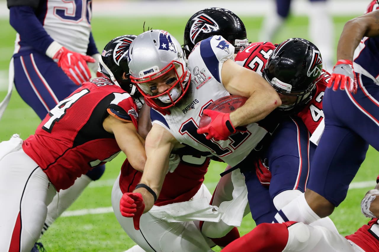 HOUSTON, TX - FEBRUARY 05: Julian Edelman #11 of the New England Patriots is tackled in the first quarter by the Atlanta Falcons defense during Super Bowl 51 at NRG Stadium on February 5, 2017 in Houston, Texas. (Photo by Jamie Squire/Getty Images)