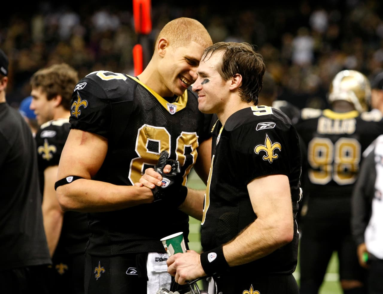New Orleans Saints quarterback Drew Brees (9) celebrates with tight end Jimmy Graham (80) after breaking Dan marino's all time season passing record in the fourth quarter of an NFL football game against the Atlanta Falcons in New Orleans, Monday, Dec. 26, 2011. (AP Photo/Rusty Costanza)