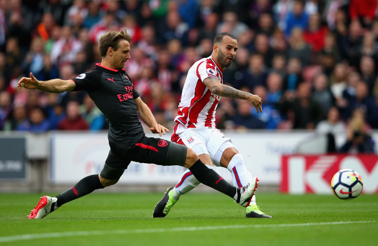 STOKE ON TRENT, ENGLAND - AUGUST 19: Jese of Stoke City scores his sides first goal as Nacho Monreal of Arsenal attempts to block during the Premier League match between Stoke City and Arsenal at Bet365 Stadium on August 19, 2017 in Stoke on Trent, England. (Photo by Alex Livesey/Getty Images)