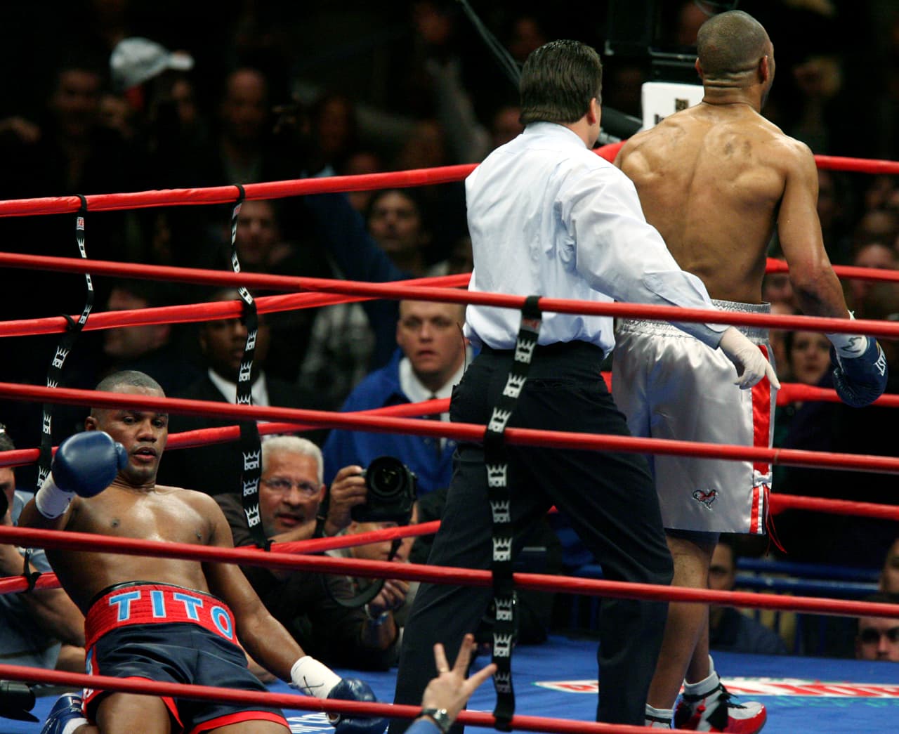 Referee Arthur Mercante, center, sends Roy Jones Jr., right, to the corner after he knocked Felix Trinidad to the matt during the seventh round of the light heavyweight boxing action Sunday, Jan. 20, 2008, at Madison Square Garden in New York. (AP Photo/Mary Altaffer)
