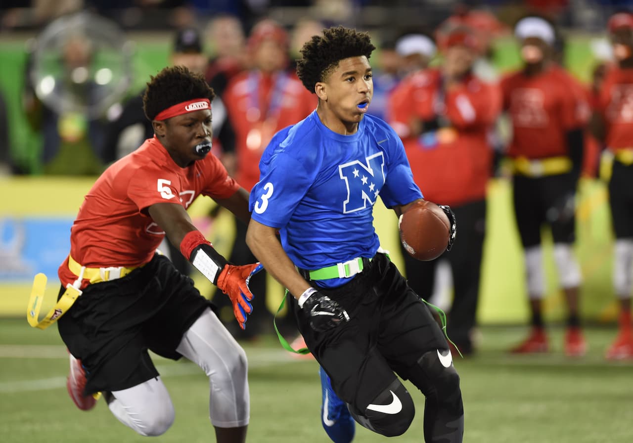 Virginia Extreme Redskins Will Paige (3) runs upfield during the 13-14 boys NFL flag football championship game Jan. 29, 2017 at the Pro Bowl in Orlando. (Al Messerschmidt via AP)