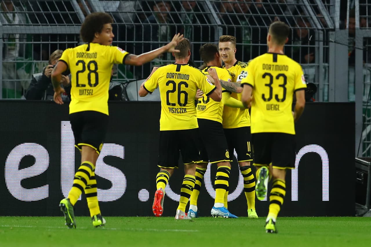 Con goles de Mario G¨otze al minuto 9 y de Marco Reus el Borussia Dotrmund empató en casa con el Werder Bremen.