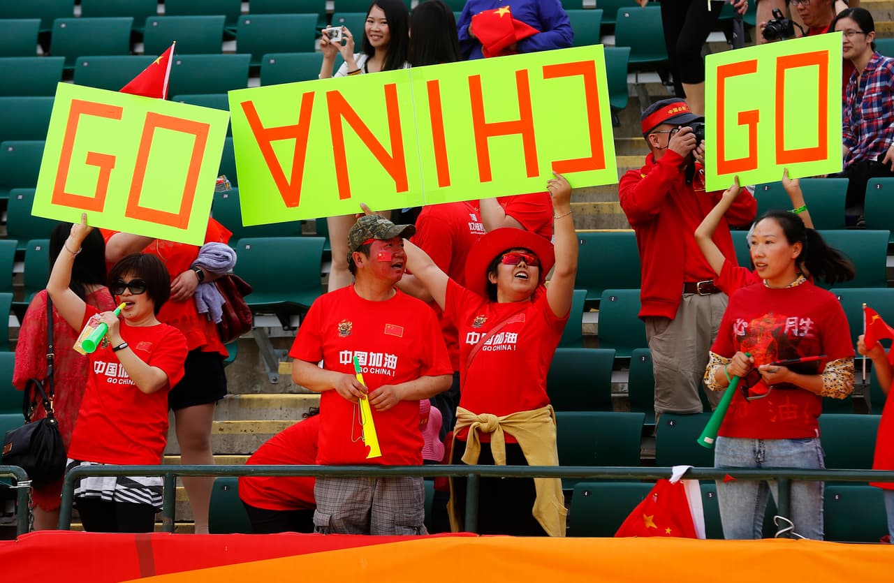 EDMONTON, AB - JUNE 20: Chinese fans cheers for their team during the FIFA Women's World Cup Canada Round 16 match between China and Cameroon at Commonwealth Stadium on June 20, 2015 in Edmonton, Alberta, Canada. (Photo by Todd Korol/Getty Images)