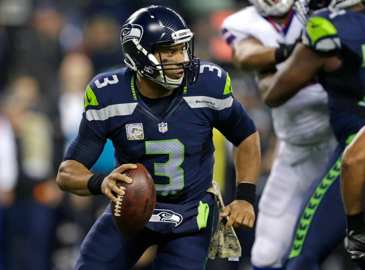 Seattle Seahawks quarterback Russell Wilson looks to pass against the Buffalo Bills in the first half of an NFL football game, Monday, Nov. 7, 2016, in Seattle. (AP Photo/John Froschauer)
