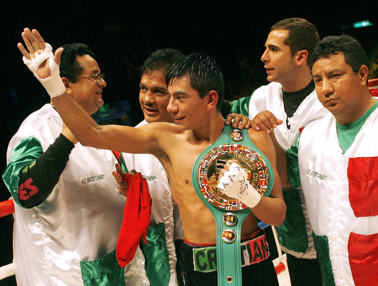 Mexico's Cristian Mijares waves with his title belt around his chest after defeating Japan's Katsushige Kawashima in a WBC Super Flyweight title fight in Tokyo Wednesday Jan. 3, 2007. Mijares defeated Kawashima by TKO in the tenth round. (AP Photo/David Guttenfelder)