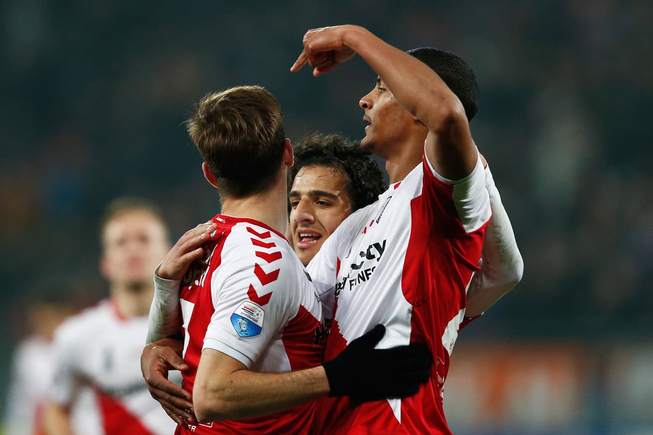 UTRECHT, NETHERLANDS - MARCH 20: Edouard Duplan (L) of Utrecht is congratulated by team mates after he scores his teams first goal during the Dutch Eredivisie match between FC Utrecht and NAC Breda held at Stadion Galgenwaard on March 20, 2015 in Utrecht, Netherlands. (Photo by Dean Mouhtaropoulos/Getty Images)