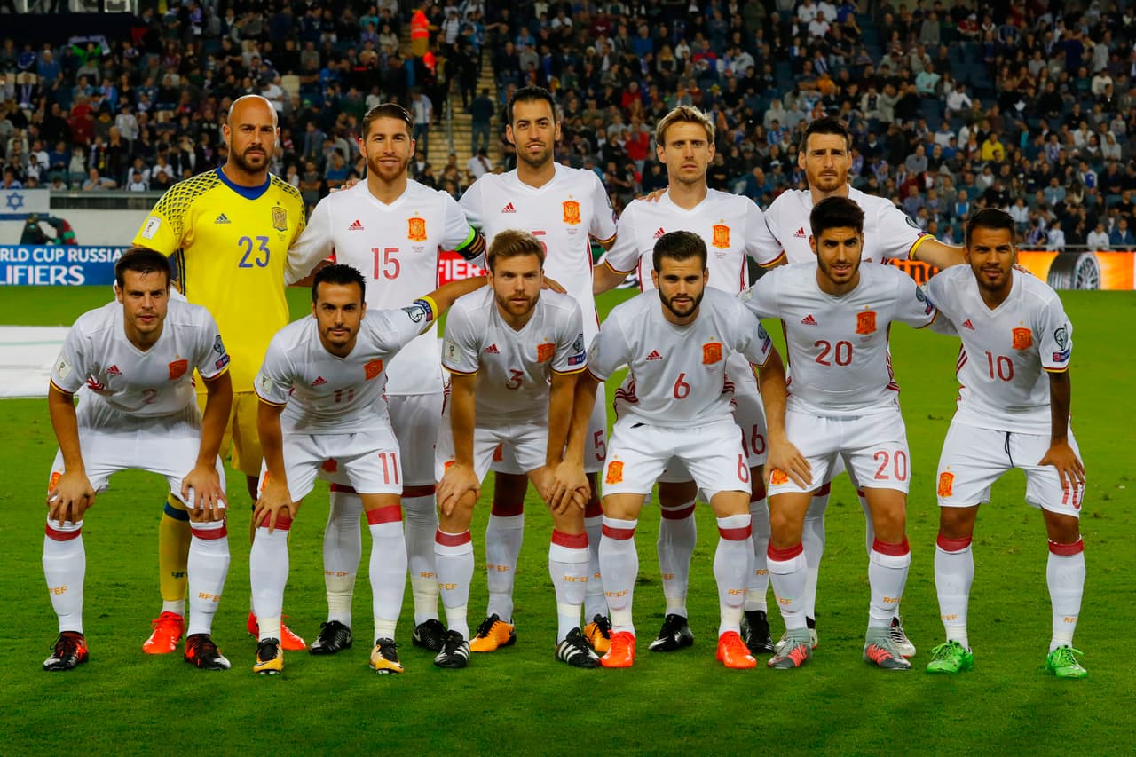 Spain's starting eleven (top from L to R) goalkeeper Pepe Reina, defender Sergio Ramos, midfielder Sergio Busquets, Nacho Monreal, forward Artiz Aduriz, (bottom from L to R) defender Cesar Azpilicueta, forward Pedro Rodriguez, midfielder Asier Illarramendi, defender Nacho Fernandez, forward Marco Asensio, midfielder Jonathan Viera, pose for a team photo prior to the Russia 2018 FIFA World Cup European Group G qualifiers football match between Israel and Spain at Teddy Kollek Memorial Stadium in Jerusalem in the center of Israel on October 9, 2017. Spain is already qualified for the 2018 World Cup in Russia. / AFP PHOTO / JACK GUEZ (Photo credit should read JACK GUEZ/AFP/Getty Images)