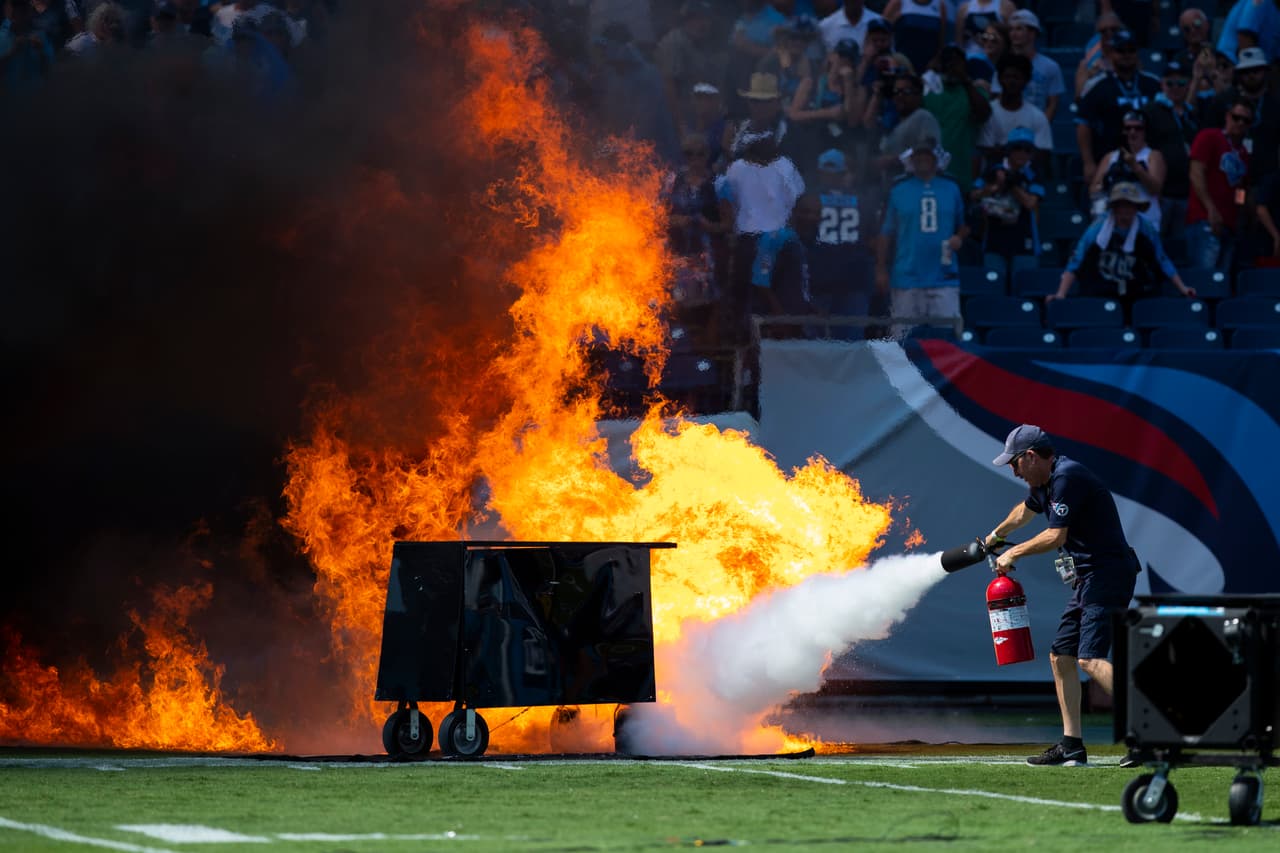 NASHVILLE, TN - SEPTEMBER 15: A failed pyrotechnic device bursts into flames before the game between the Tennessee Titans and the Indianapolis Colts at Nissan Stadium on September 15, 2019 in Nashville, Tennessee. (Photo by Brett Carlsen/Getty Images)