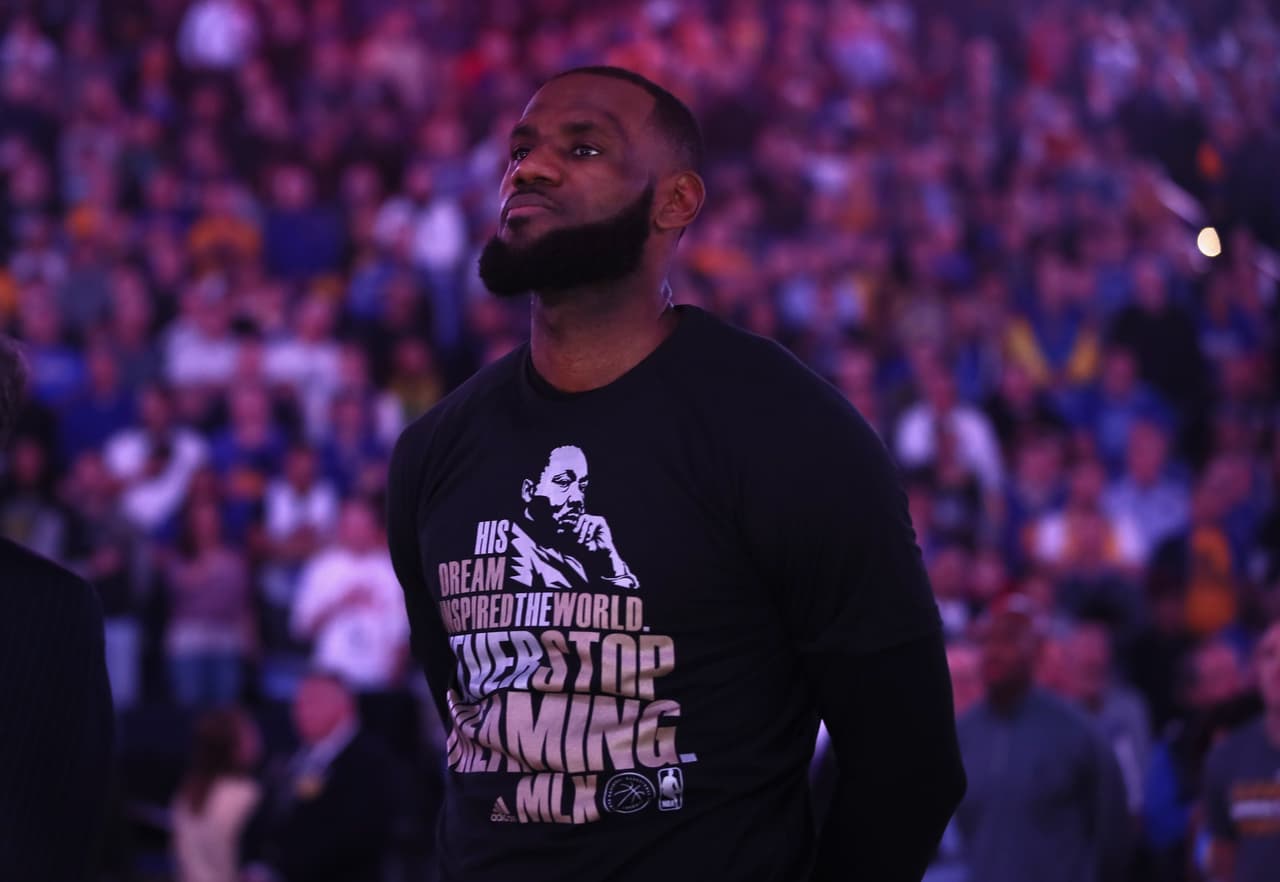 OAKLAND, CA - JANUARY 16: LeBron James #23 of the Cleveland Cavaliers wears a shirt honoring Martin Luther King Jr. during the playing of the National Anthem before their game against the Golden State Warriors at ORACLE Arena on January 16, 2017 in Oakland, California. NOTE TO USER: User expressly acknowledges and agrees that, by downloading and or using this photograph, User is consenting to the terms and conditions of the Getty Images License Agreement. (Photo by Ezra Shaw/Getty Images)