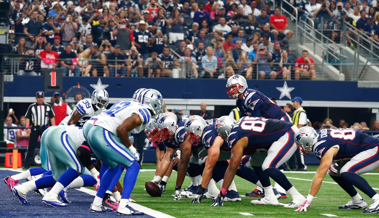 New England Patriots quarterback Tom Brady (12) calls a play at the line of scrimmage during an NFL football game against the Dallas Cowboys at AT&T Stadium on Sunday, Oct. 11, 2015 in Arlington, Texas. New England won 30-6. (Aaron M. Sprecher via AP)